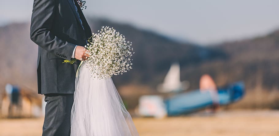 man holding white bouquet, apparel, clothing, human, person, robe HD wallpaper