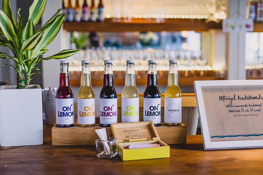 On Lemon Bottles on Rack Placed on Table, alcohol, bar, beer HD wallpaper