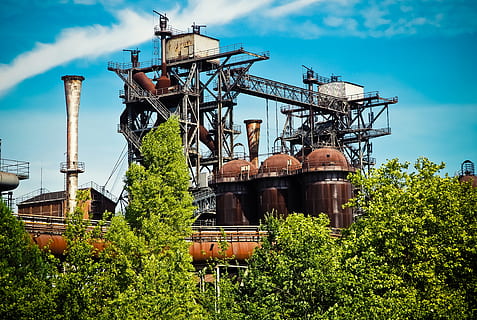 Green Trees Outside Factory, blue sky, building, chimney, clouds HD wallpaper