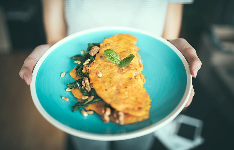 egg omelet dish, food and drink, human hand, focus on foreground HD wallpaper