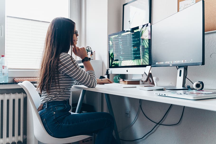 girl using desktop computer in room, furniture, table, human