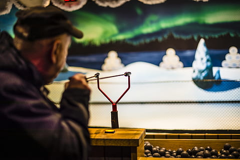 man playing slingshot, human, person, gothenburg, liseberg, sweden HD wallpaper