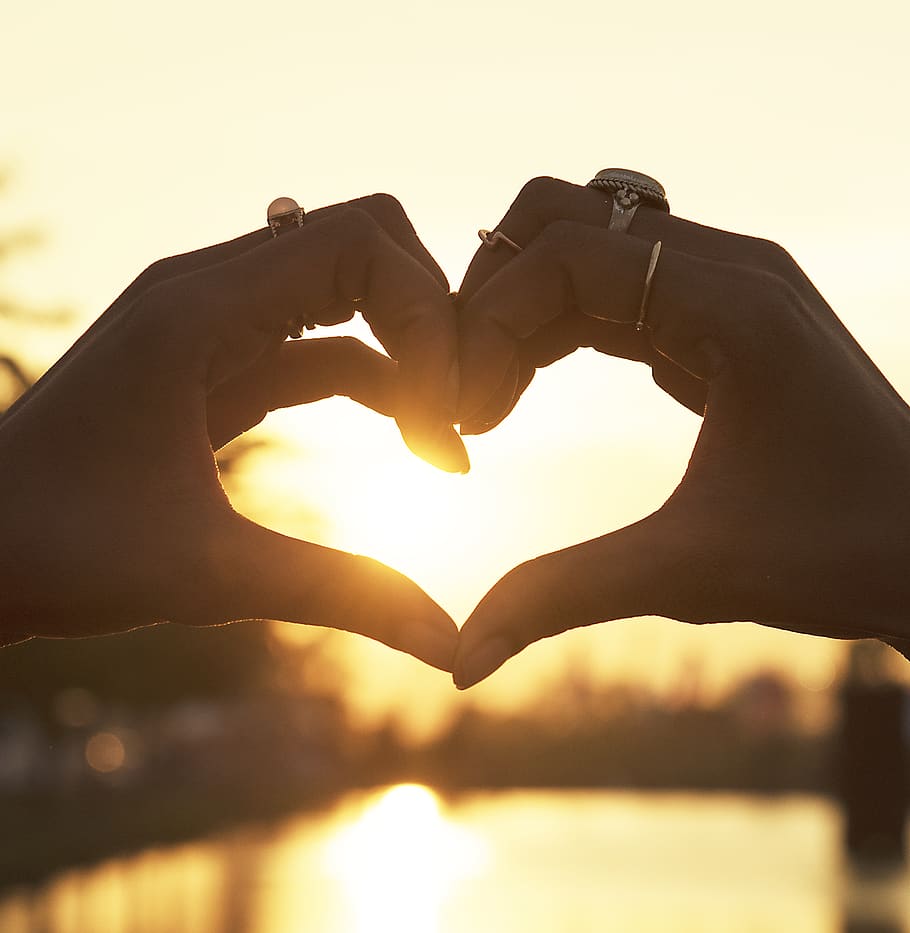 Person Wearing Gold Rings, dawn, hands, heart, shape, sunrise HD wallpaper