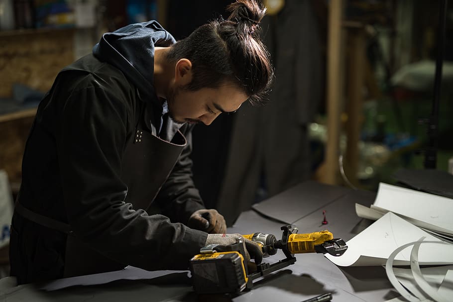 man holding power tool, occupation, working, real people, one person HD wallpaper