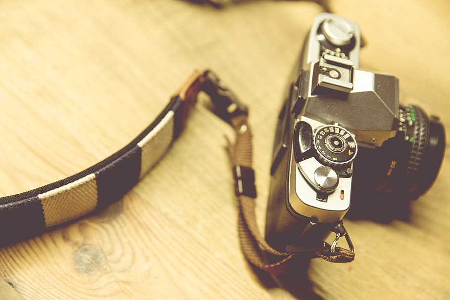 Black Camera With White and Black Strap on Beige Surface, camera strap HD wallpaper