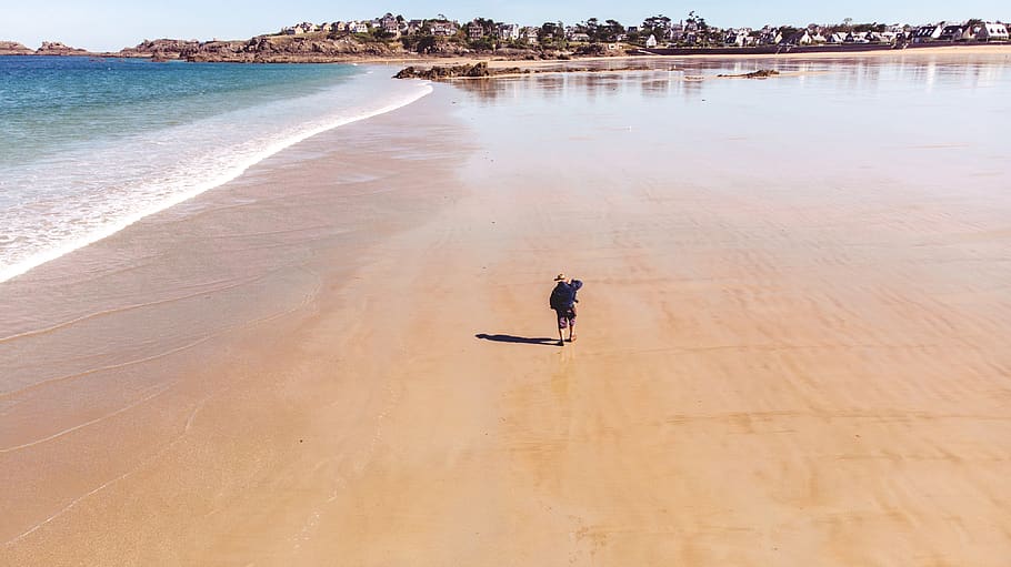 man walking on beach during daytime, france, saint-lunaire, nature HD wallpaper