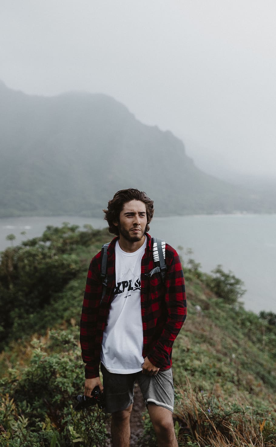 man walking on mountain, looking at camera, standing, fog, casual clothing HD wallpaper