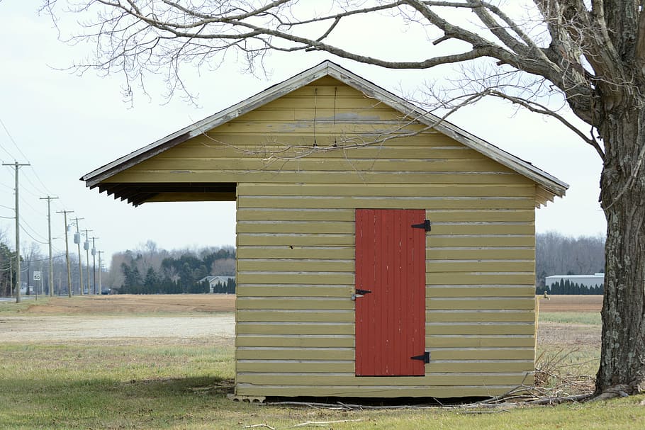 A small building on the side of the road built for selling produce. HD wallpaper
