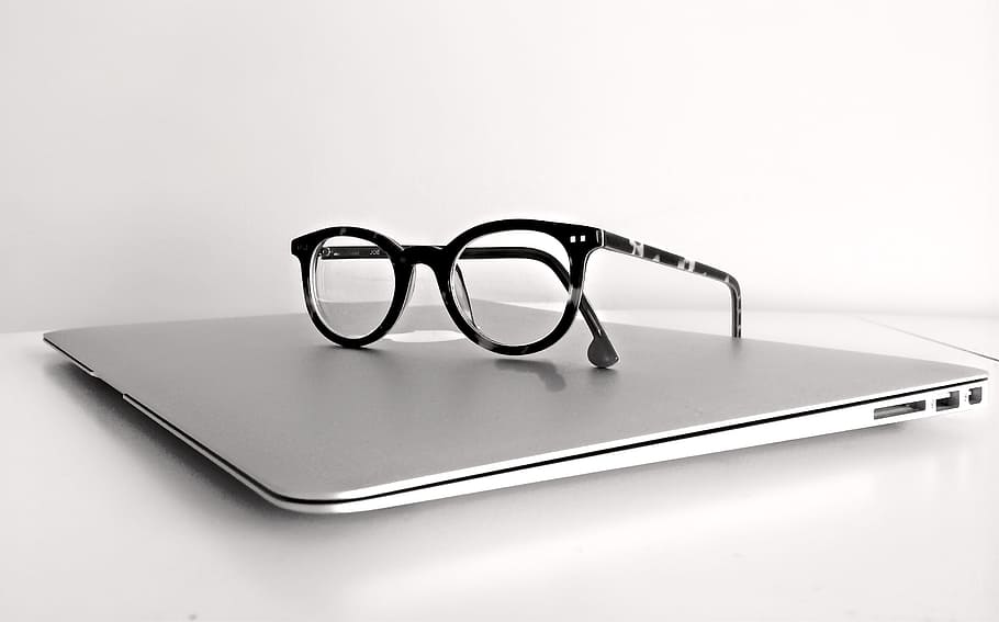 Black Frame Eyeglasses on Silver Macbook Air, apple, computer HD wallpaper