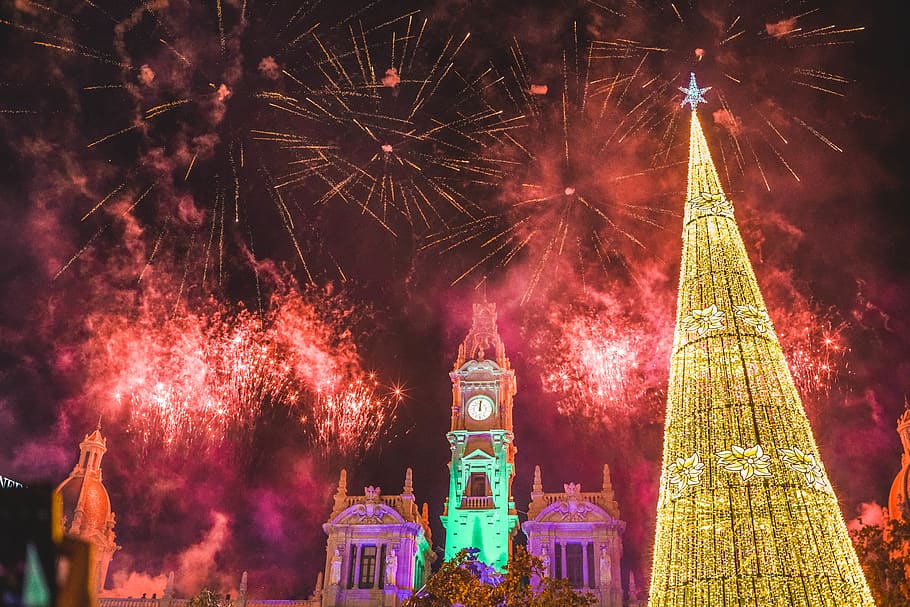 yellow Christmas tree under fireworks display, nature, outdoors HD wallpaper