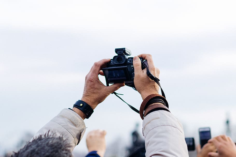 person holding black DSLR camera taking picture during daytime, HD wallpaper