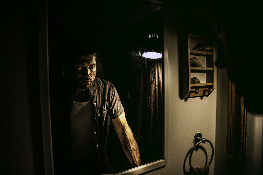 Man Standing in Front of Mirror, dark, facial expression, fashion