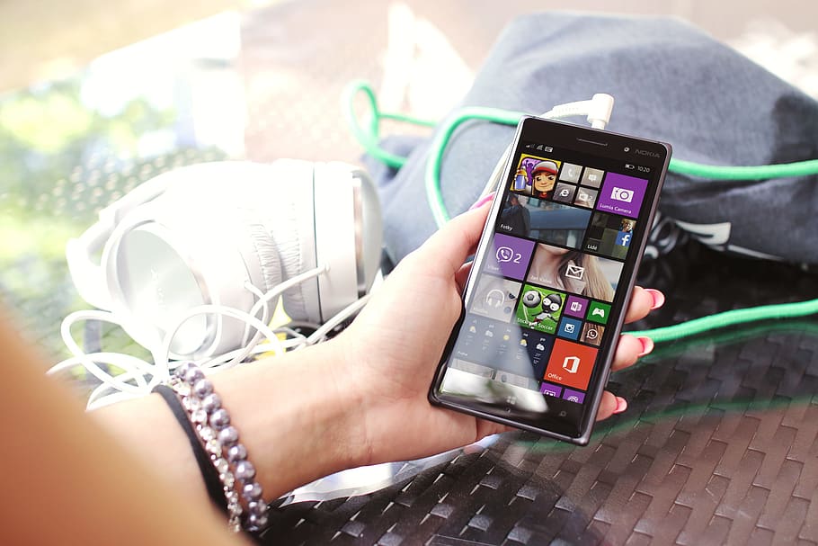 Modern smartphone in hand over glass table, human hand, technology HD wallpaper