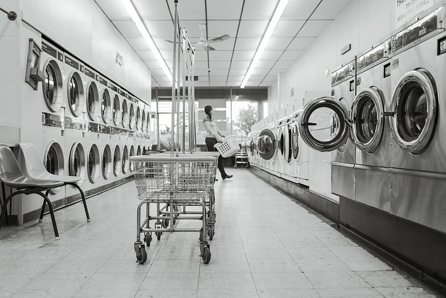 Grayscale Photography of Woman in Laundry Shop, black-and-white
