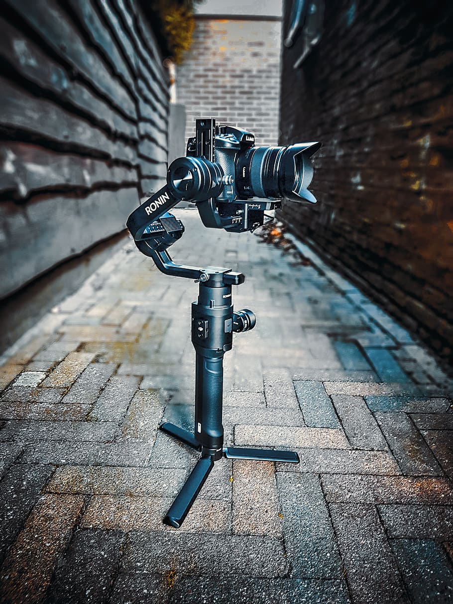 black studio camera in between building, technology, no people HD wallpaper