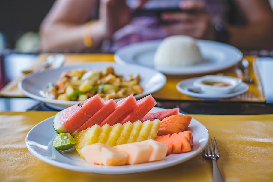 Round Ceramic Plate Filled With Sliced Watermelon, Pineapple, and Carrots HD wallpaper