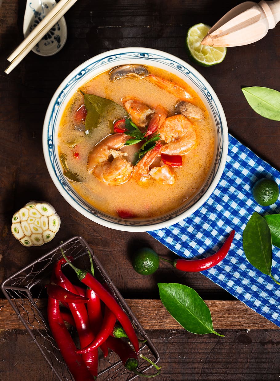 Shrimp Soup in White Ceramic Bowl With Chili on Brown Wooden Surface
