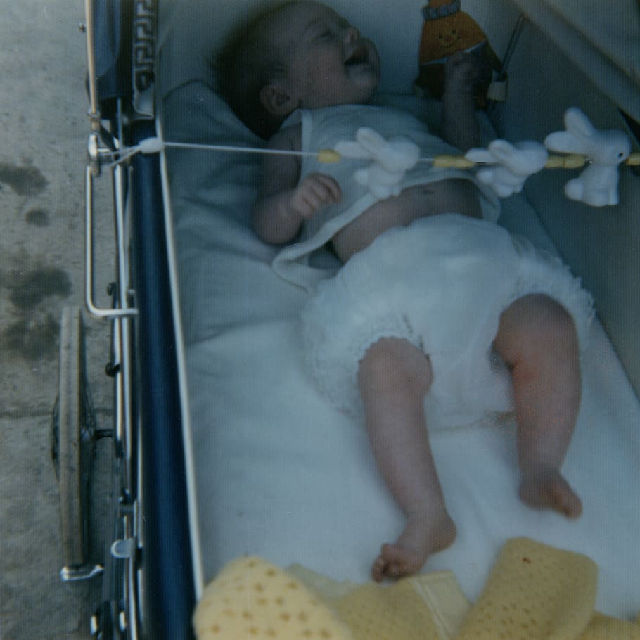 Baby in vintage pram, furniture, cradle, 35mm, analog, film photo