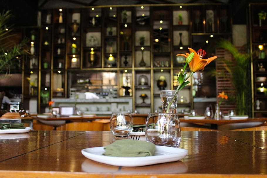 Orange Daylily on Clear Glass Pitcher on Brown Wooden Dining Table With Dinnerware HD wallpaper