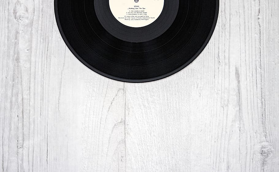 Black Vinyl Record on Wooden Surface, antique, black-and-white