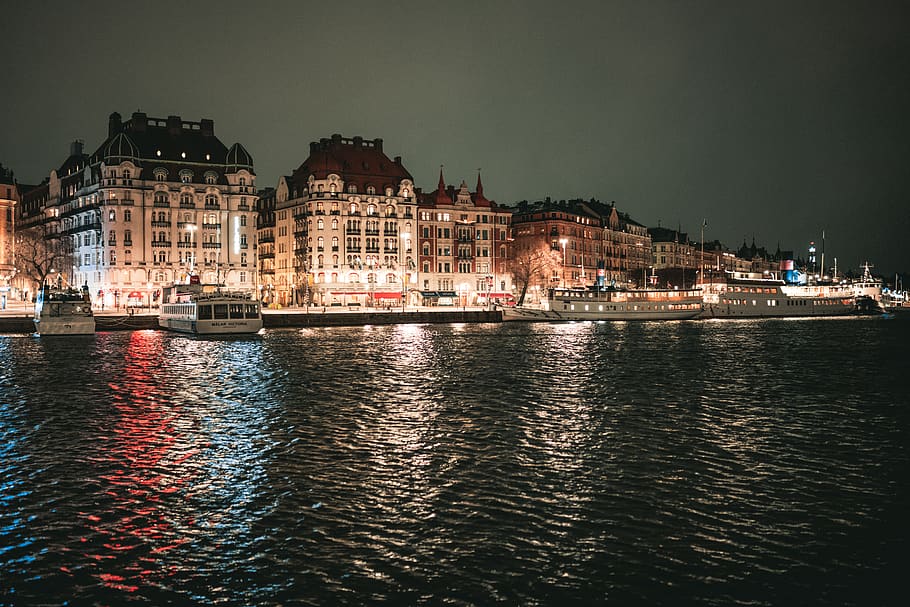 buildings with lights during nighttime, water, boat, vehicle HD wallpaper
