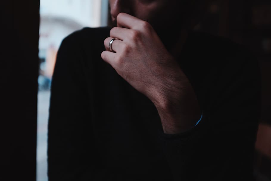 man wearing black sweater, hand, person, human, finger, chios