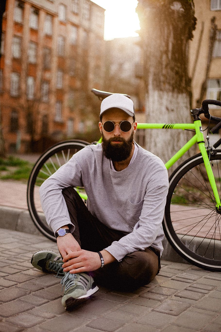 Photo of Man Sitting Near Bike, adult, beard, bicycle, blur, cap, HD wallpaper