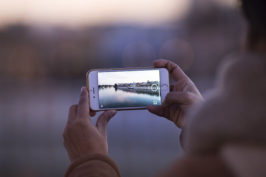 Person Holding Gold Iphone 5s, blur, camera, capture, electronics HD wallpaper