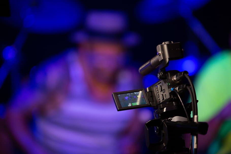 Black Video Camera Near Person, blur, electronics, illuminated HD wallpaper