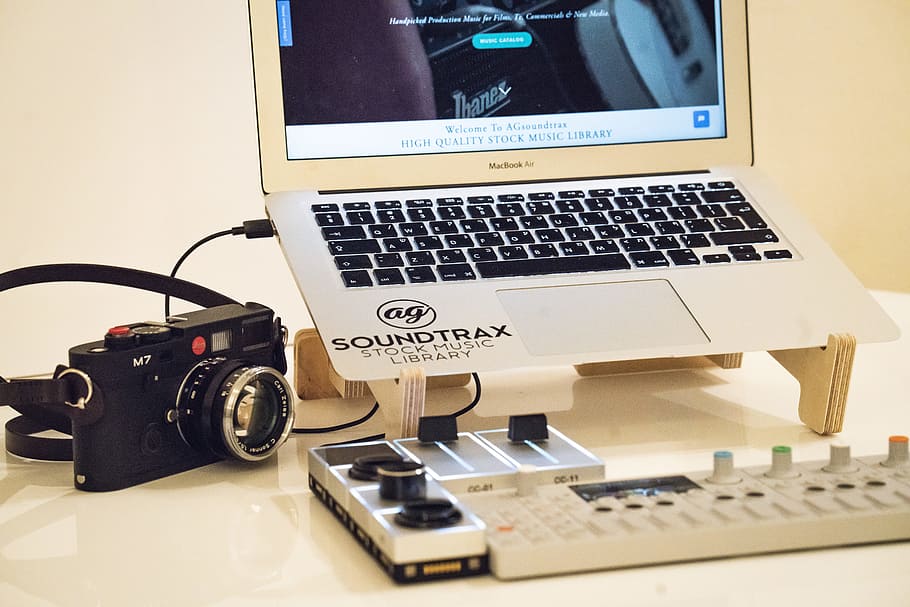 MacBook Air beside black M7 camera, laptop, audio, knobs, slider HD wallpaper