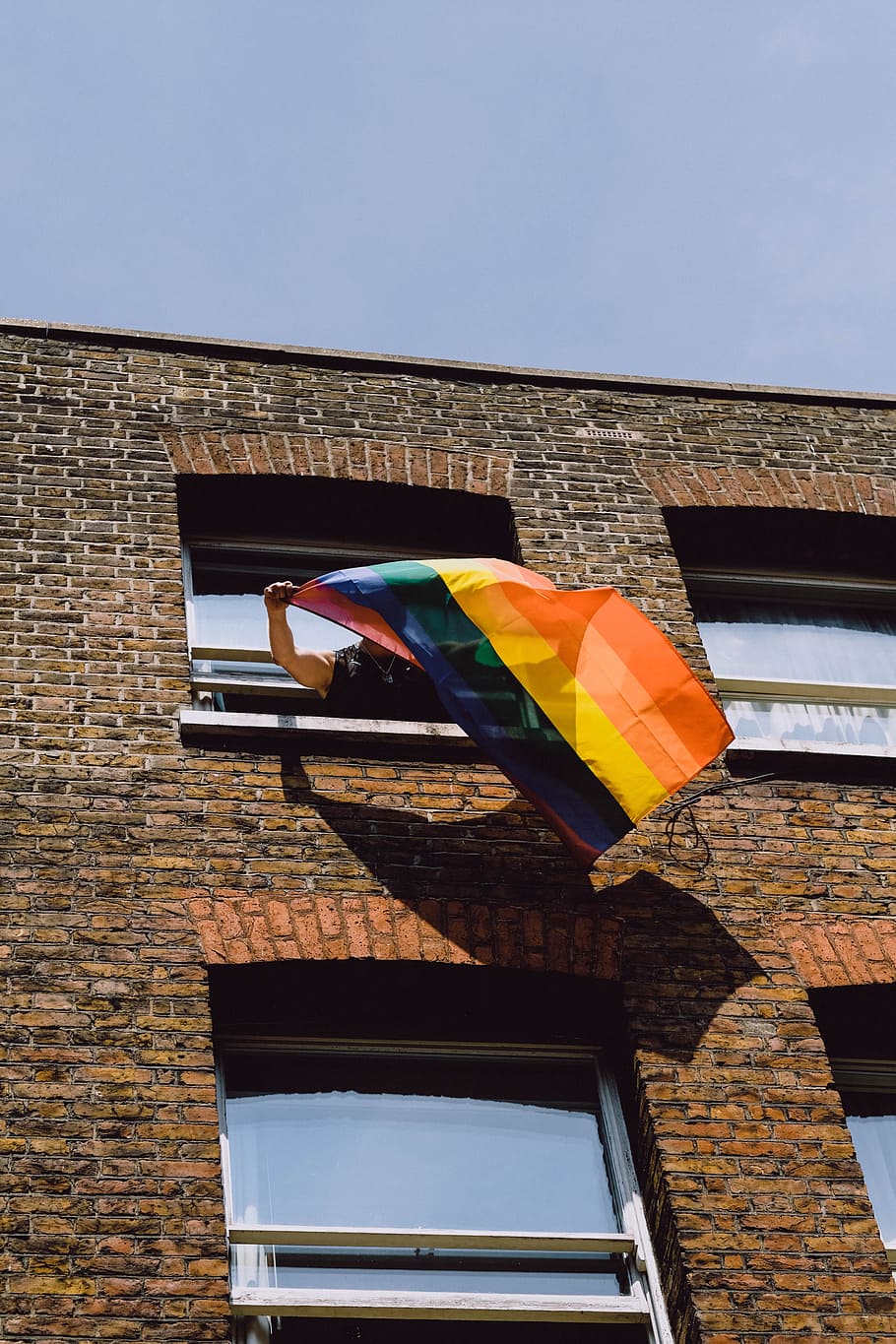 person holding flag, pride, brick, window, wall, colour, hand HD wallpaper