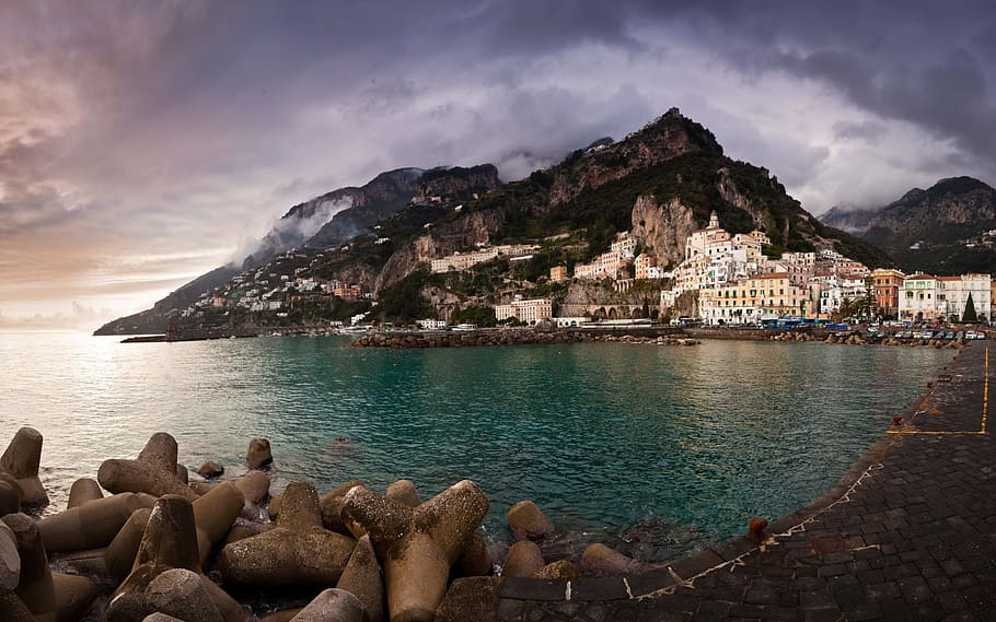 Beach With White Houses during Day Time, clouds, mountain, ocean HD wallpaper