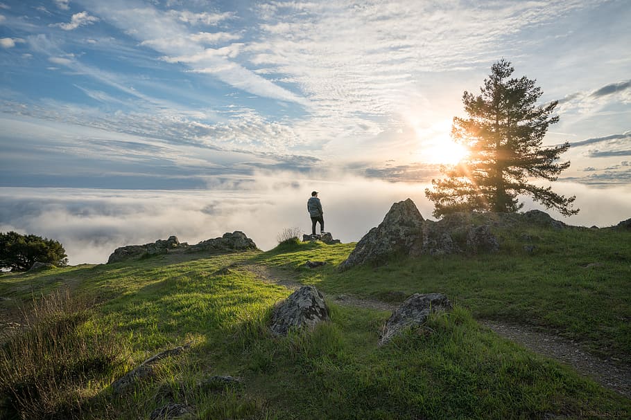 person standing on top of the mountain under cloudy sky, summit HD wallpaper