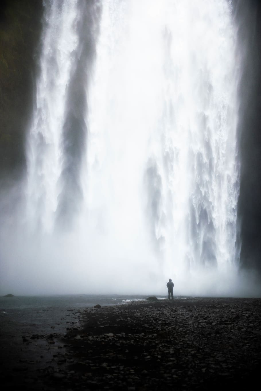 HD wallpaper: man standing in front of waterfalls, nature, outdoors ...