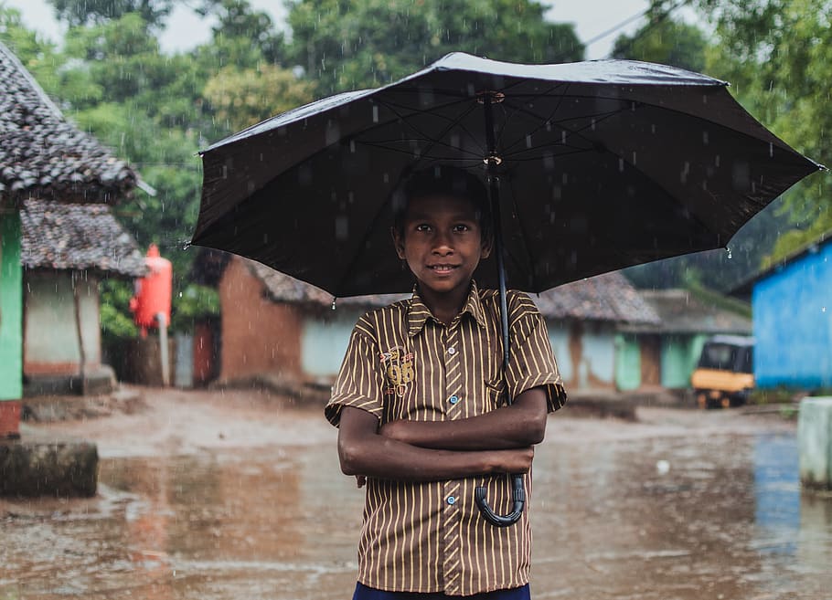Boy Holding Black Umbrella, posing, rain, raining, standing, village HD wallpaper