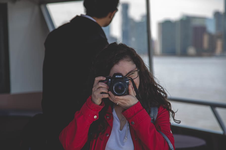 Woman Taking Photograph Beside Man, camera, focus, nikon, photographer HD wallpaper