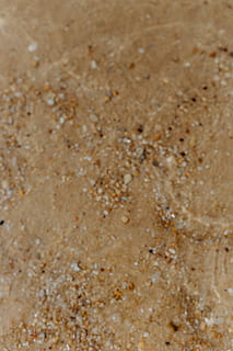 Sand beach background with sea shells & pebbles - many round small stones HD wallpaper