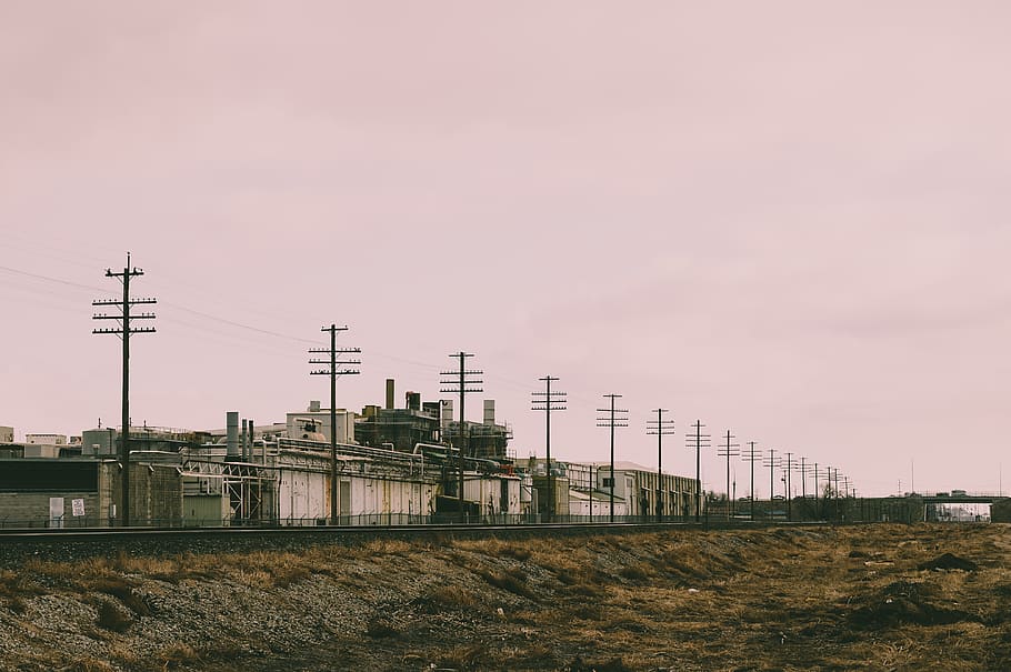 Line of Electric Post Near Concrete Building, cables, clouds HD wallpaper