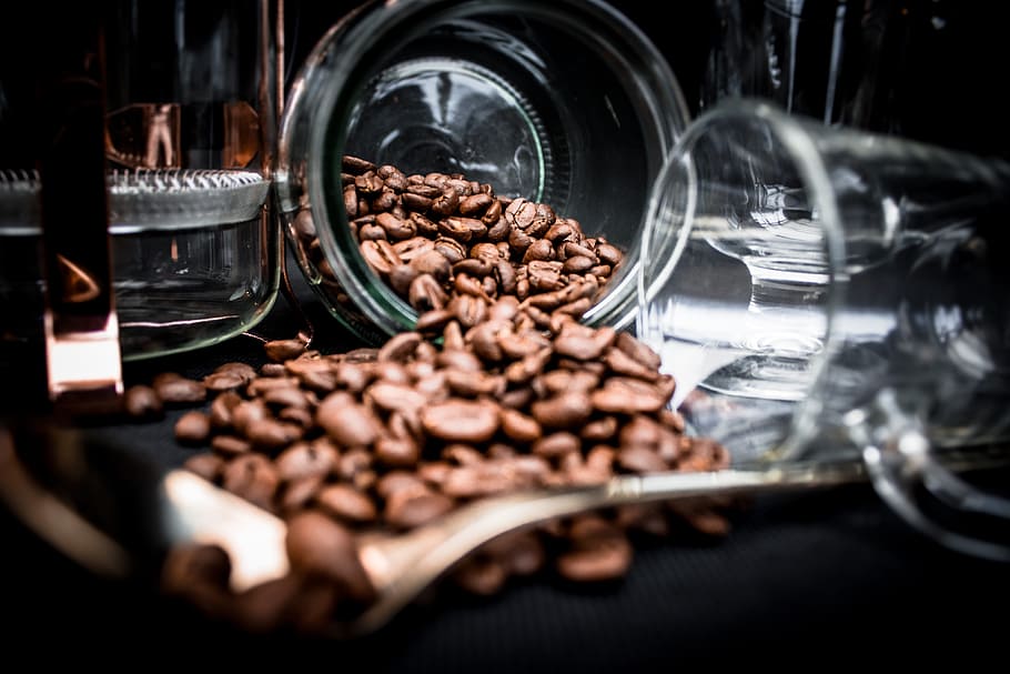 Coffee Beans Spoiling on Clear Glass Jar Near Clear Glass Mug HD wallpaper