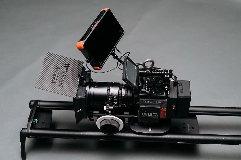 black video camera on black rack, electronics, digital camera