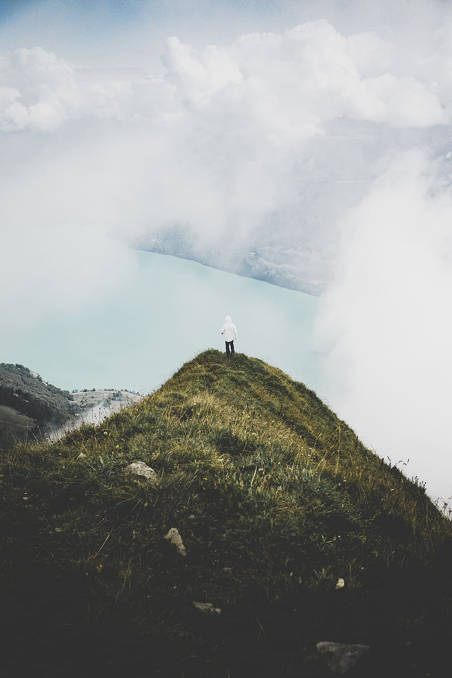 Person Standing on Green Grass Mountain, adventure, cliff, cloud HD wallpaper
