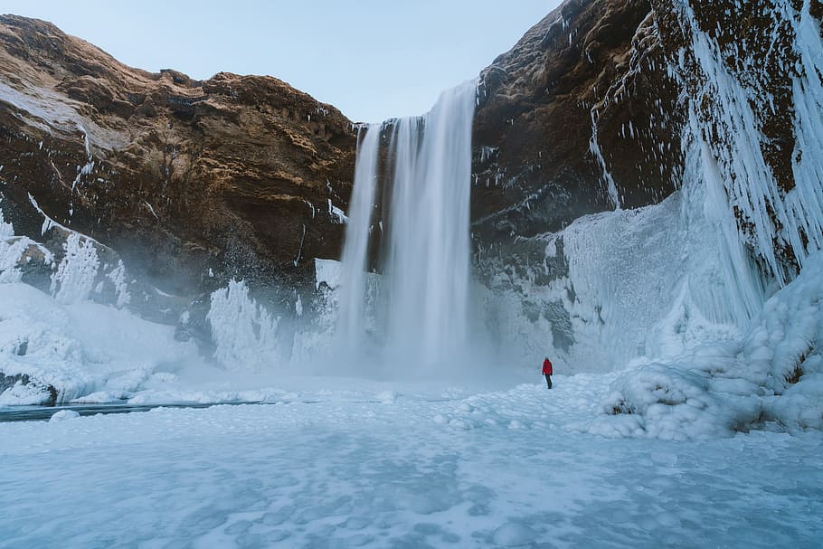 Person Walking on Snowfield, adventure, arctic, cliff, cold, daylight HD wallpaper