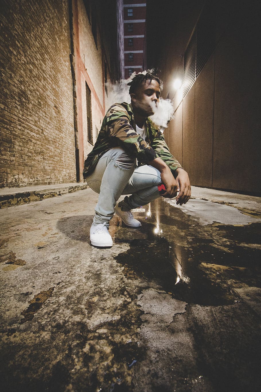 man sitting down between concrete wall, apparel, person, town HD wallpaper
