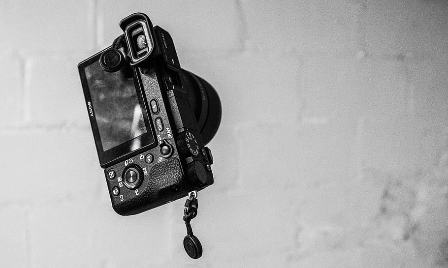 black MILC on grey wall, technology, indoors, close-up, no people HD wallpaper