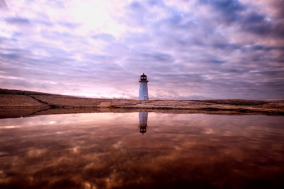 White Lighthouse Near Body of Water, calm, clouds, cloudy, dark HD wallpaper