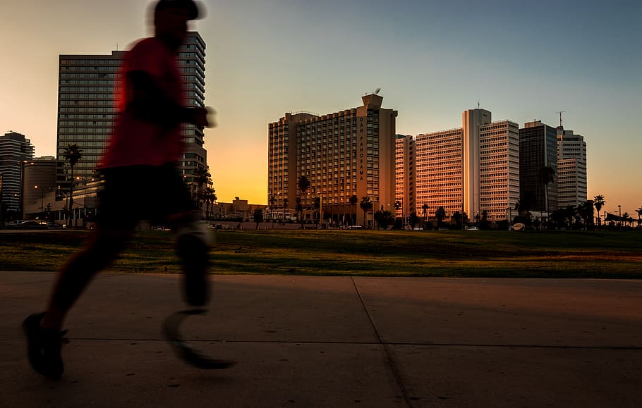 man running on pavement during daytime, building exterior, built structure HD wallpaper