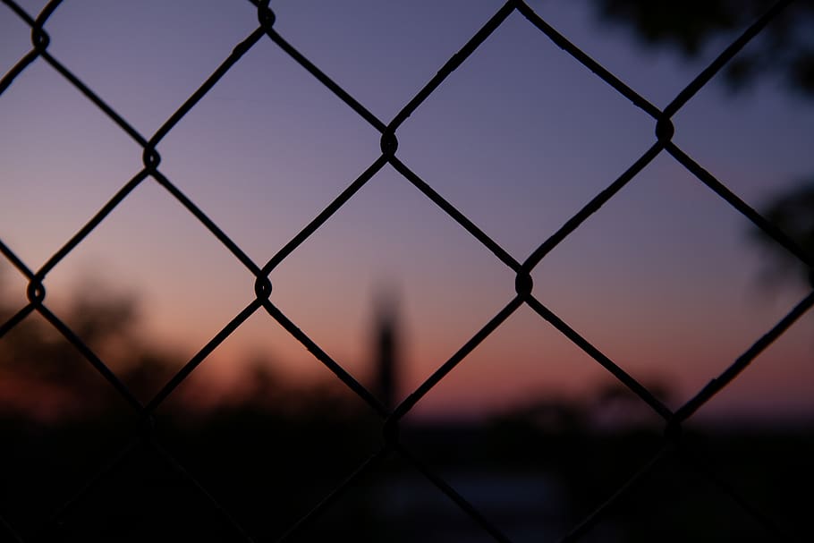 selective focus photography of fence, silhouette, pattern, sunset