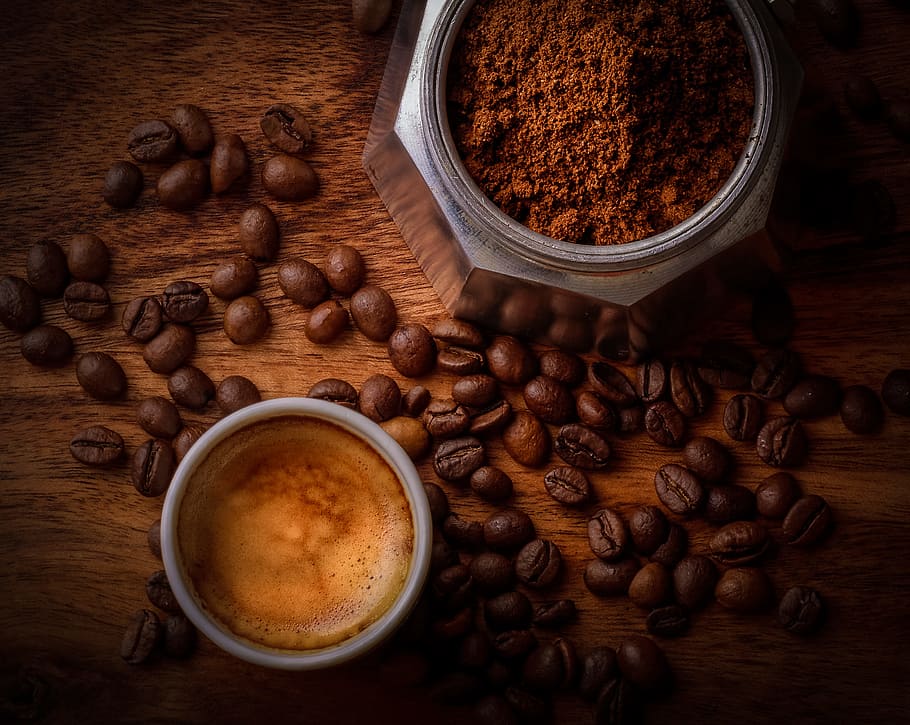 brown coffee beans beside white ceramic mug, flatlay, jear, wooden