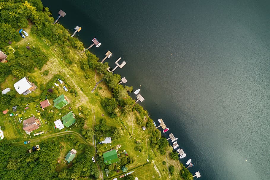 Amazing aerial view. Houses in the woods near the river at summer HD wallpaper