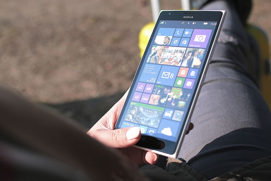 Person Using Black Nokia Windows Phone, digital, hand, media HD wallpaper